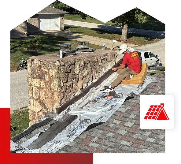 A worker in a red shirt and hat repairs shingles next to a stone chimney on a roof, with tools and roofing materials spread out. A white Be Dry Roofing truck is parked on the street below, offering expert roofing services in Quincy IL.